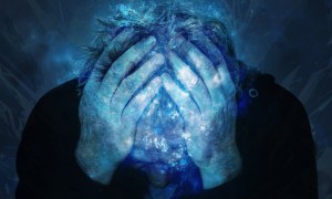 Man with head in hands